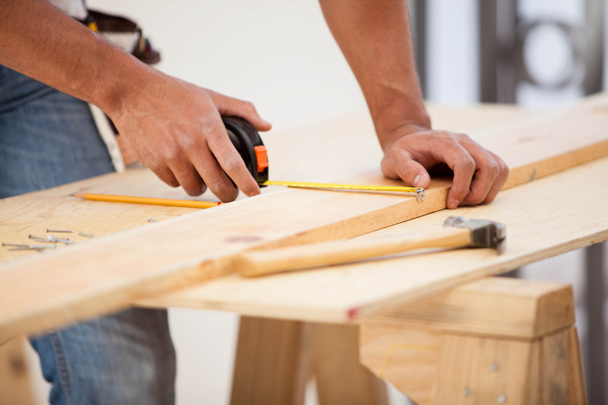 An image of a person working on building projects - choose the right contractor for your project in Sacramento with these expert tips from RiseCon North America!