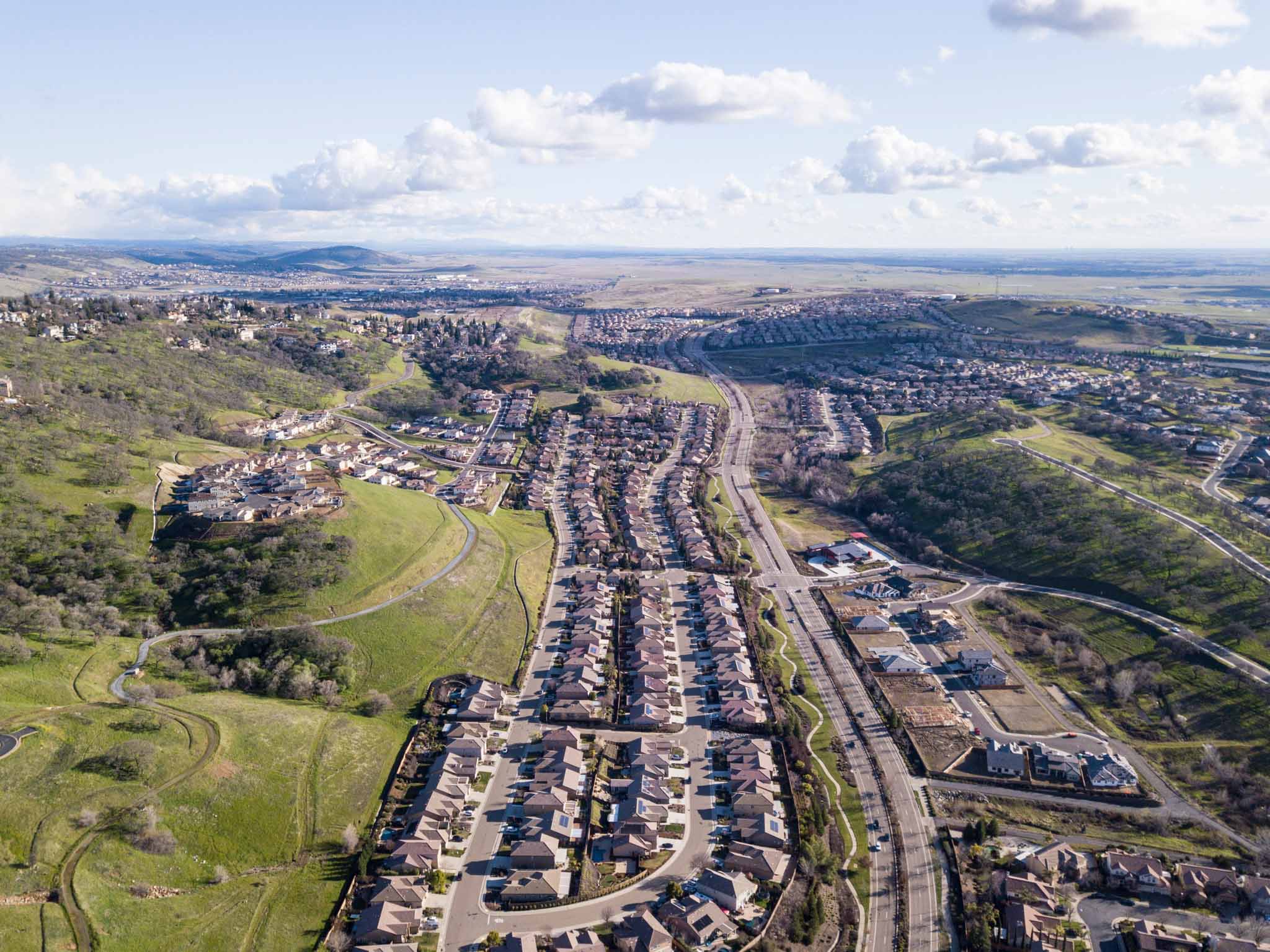 A wide shot of a city - RiseCon is the premier tiny home builders in North Highlands, CA.