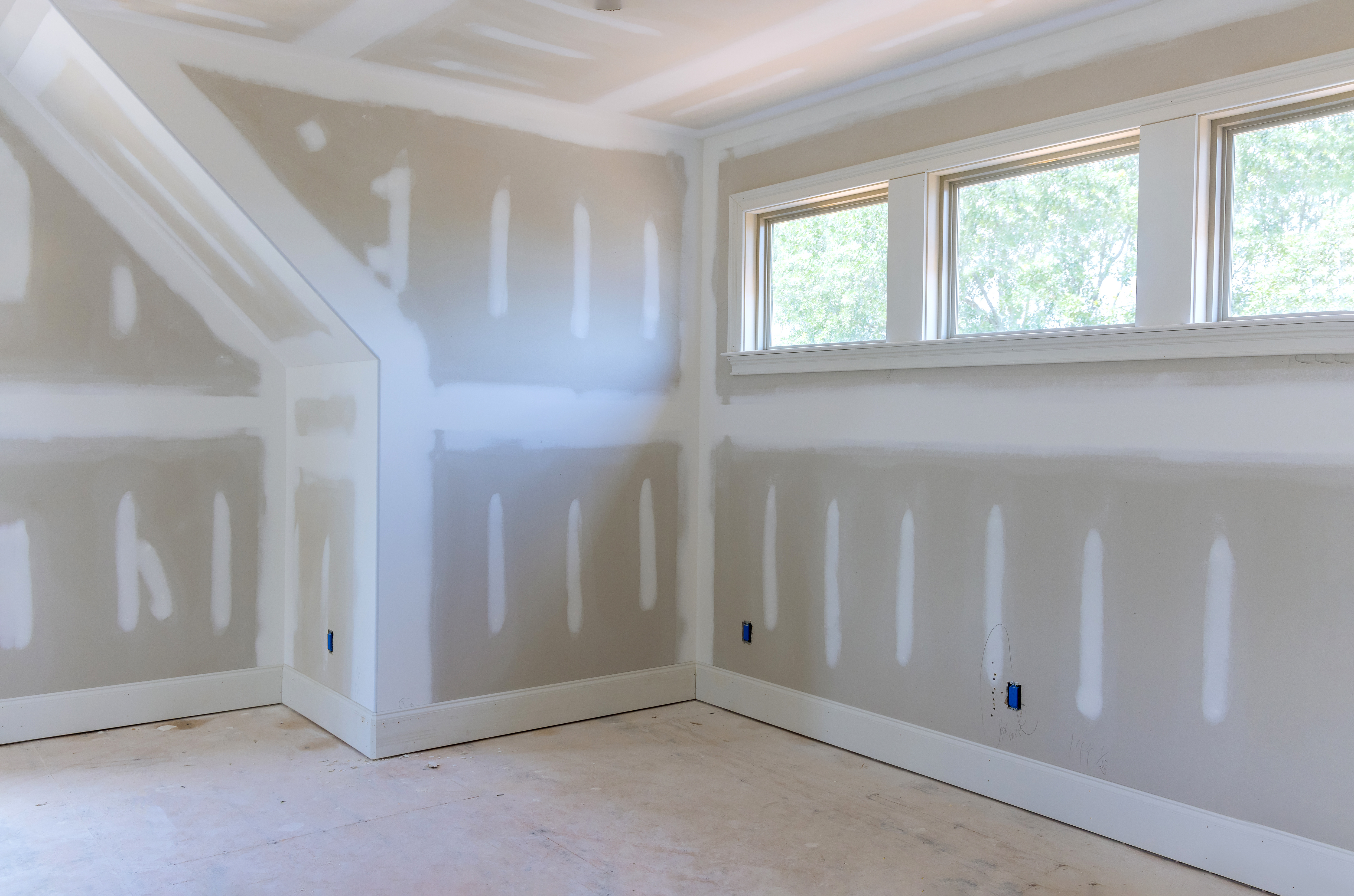 The interior of a shell ADU with finished sheetrock walls, ready to be designed.