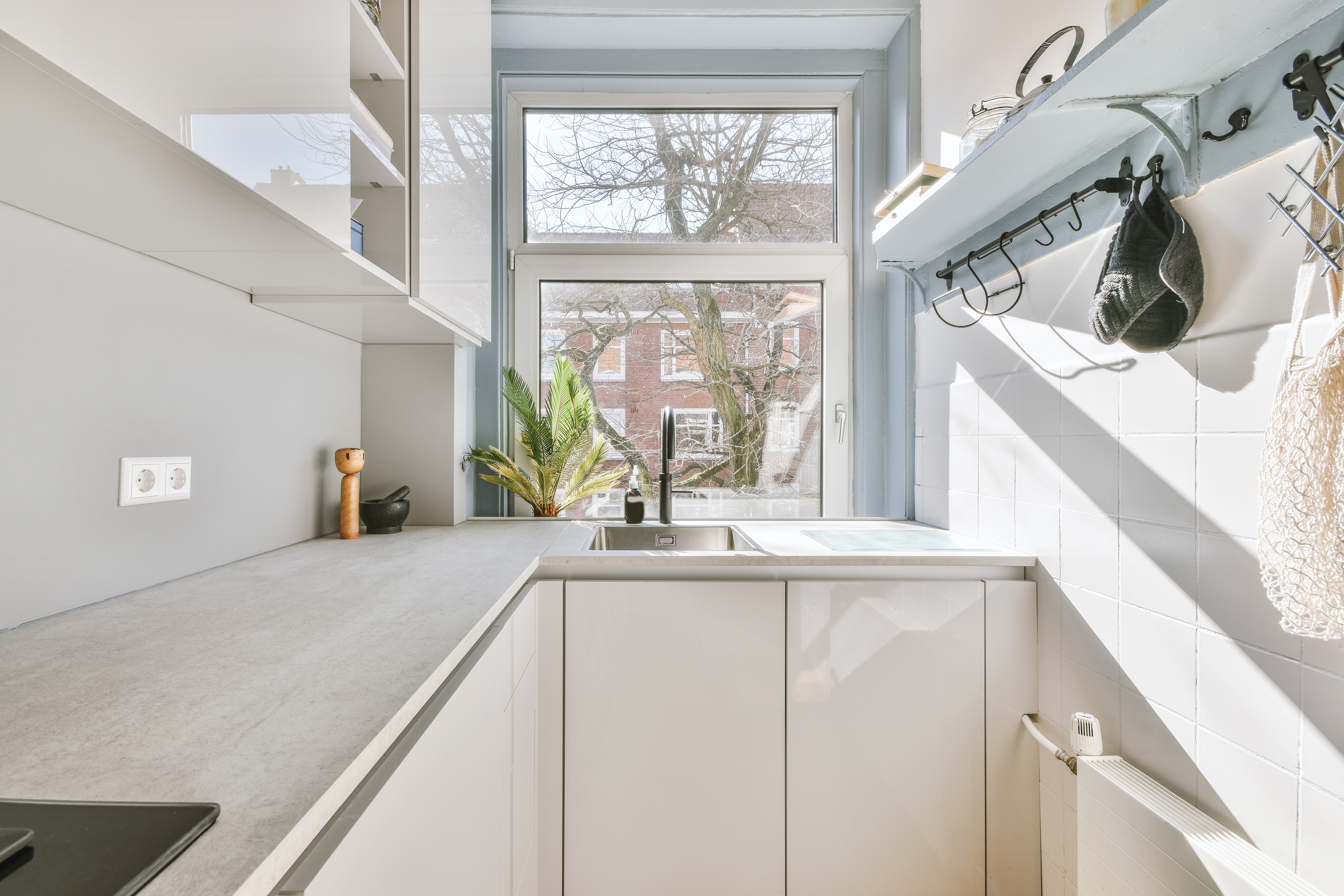 The kitchen of a luxurious tiny home built by RiseCon, luxury tiny home builders in California.