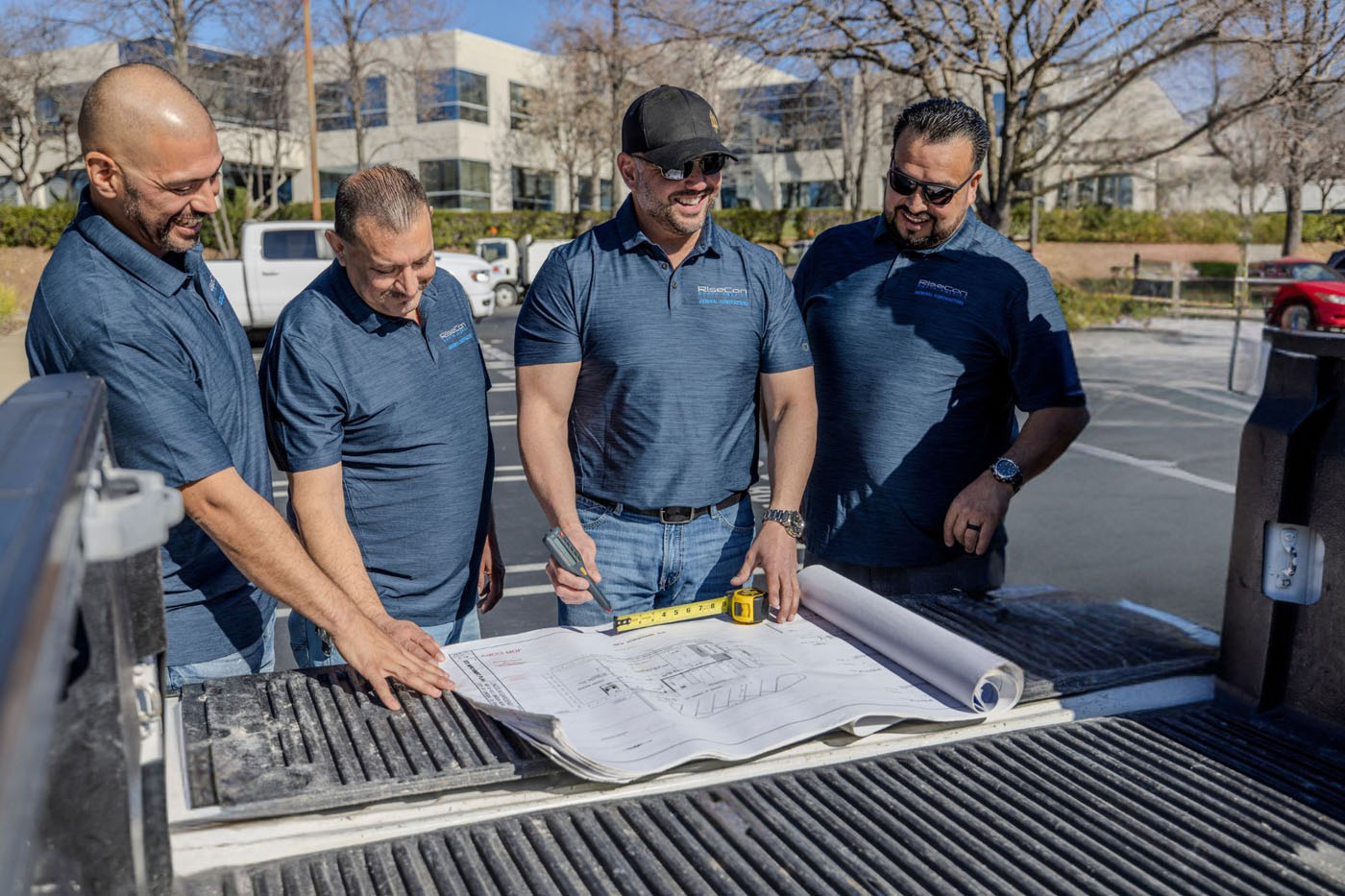 RiseCon Sacramento garage contractors looking at contruction plans.