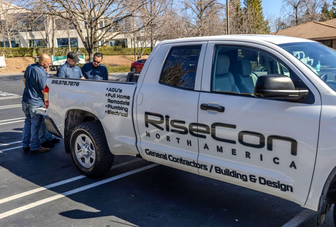 RiseCon Sacramento accessory dwelling unit contractors in front of their work truck.