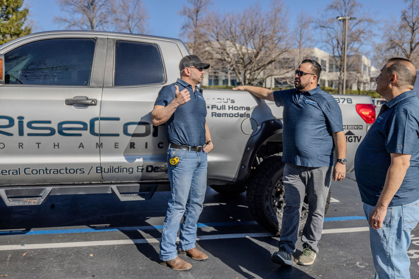 RiseCon Sacramento ADU architects standing in front. of their work truck.